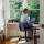 Woman Using a Laptop in a Home Office