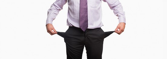 Mid section of a businessman with pockets pulled out