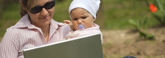 Mother works on laptop